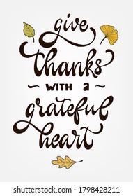 cute thanksgiving lettering quote 'Give thanks with a grateful heart' decorated with leaves. Good for cards, posters, prints, invitations, signs, etc. Festive typography inscription. EPS 10