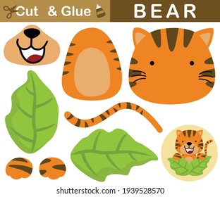 Cute tiger appearing from leaves. Education paper game for children. Cutout and gluing. Vector cartoon illustration