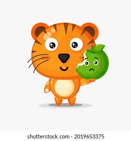 Cute tiger character carrying green apple