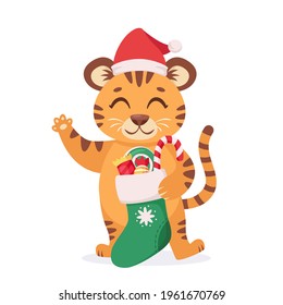 Cute tiger with Christmas sock and candies. Year of the tiger. Vector illustration