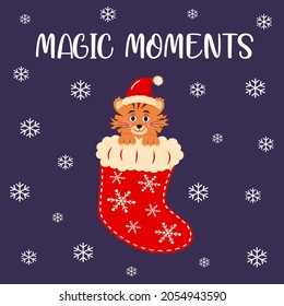 A cute tiger in the Christmas sock. Magic moments lettering. Christmas greeting card.