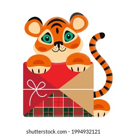 cute tiger cub with holiday box isolated on white background. clip art, greeting card for happy birthday, new year. flat bright pattern with textures. stock vector illustration. EPS 10.