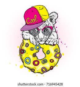 Cute tiger cub and a large multi-colored donut. Vector illustration.