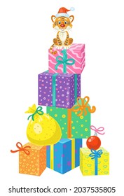 Cute tiger cub in a Santa hat sits on a high tower made of multi-colored gift boxes. In cartoon style. Isolated on white background. Vector illustration