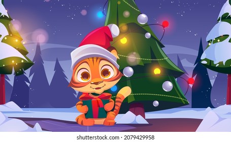 Cute tiger with gift box in winter forest with Christmas tree at night. Vector cartoon illustration of woods landscape with decorated fir, snow and funny kitten in red Santa Claus hat with present