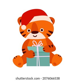 Tigre lindo con sombrero de santa con caja de regalo. Ilustración vectorial al estilo de las caricaturas. Aislado sobre fondo blanco.