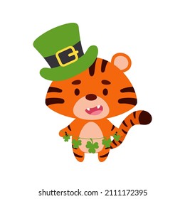 Cute tiger in St. Patrick's Day leprechaun hat holds shamrocks. Irish holiday folklore theme. Cartoon design for cards, decor, shirt, invitation. Vector stock illustration.