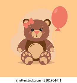 A cute toy teddy bear with a balloon sits on a beige background.