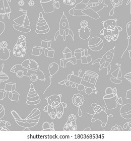 Cute toys seamless pattern. Outline elements isolated on gray background. For background, textile, baby shower, fabric print, wrapping paper. Hand drawn vector illustration