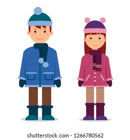Cute twins kids boy and girl in winter clothes.