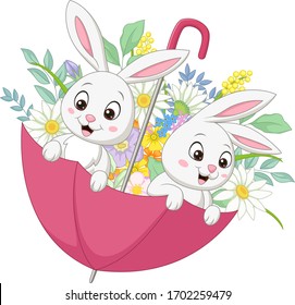 Cute two bunnies in the spring umbrella with flowers