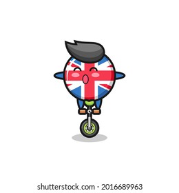 The cute united kingdom flag badge character is riding a circus bike , cute style design for t shirt, sticker, logo element