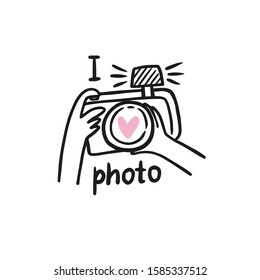 Cute vector card with photo camera and lettering - I love photo. Human hands holds a camera and photographs. Hand drawn illustration.