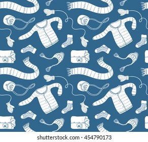 Cute vector collection of handmade clothes isolated on the blue background. Vector seamless pattern.