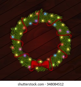 Cute vector illustration of Christmas wreath with fir branches, multicolored garland and red decorative bow and beads on wooden background. Can be used in design of cards. EPS 10 file. Fully editable.