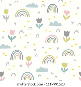 Cute vector pattern with flowers, rainbows and clouds. Spring abstract hand drawn whimsical seamless background in pastel colors.