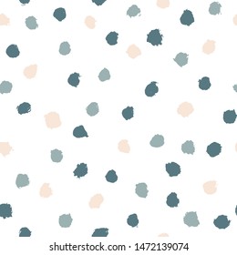 Cute vector Scandinavian polka dot seamless pattern. Hand drawn brush texture in blue and beige color. Ideal for textiles, wallpaper, wrapping paper, fabric, etc.
