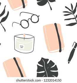 Cute vector seamless pattern of autumn and winter hygge blogger elements - candle, notebook, monstera leaf, glasses, book. Isolated on white background. Scandinavian style. 