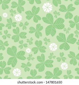 Cute vector seamless pattern with green clover and white flowers