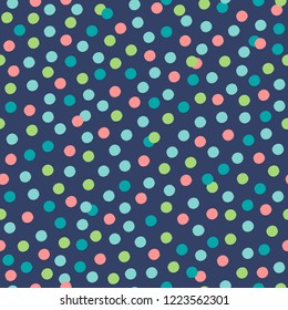 Cute vintage scattered confetti  pattern. Colorful polka dots on dark blue background. Pretty retro celebration seamless vector pattern. 