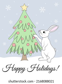 Cute white bunny decorating the Christmas tree and wishing Happy Holidays