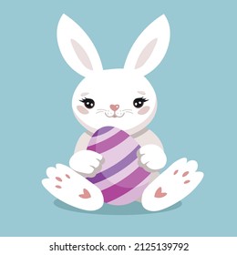
Cute white bunny with an easter egg.