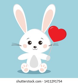 Cute white bunny rabbit in sitting pose with a red lollipop in the shape of a heart - candy holyday gift on blue background in cartoon style. Vector flat design sweet animal character illustration. 