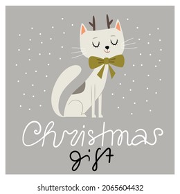 Cute white cat with a green gift bow. Cat with deer horns. A cat as a gift for Christmas.