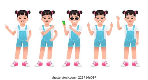 A cute white child is standing with a smartphone in his hand, pointing at something, waving his hand. Little beautiful girl in full growth. The girl stands in different poses.