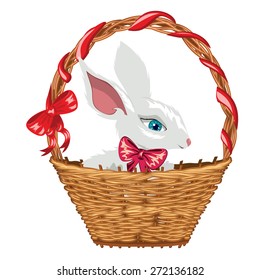 Cute white Easter bunny in basket with red bow.