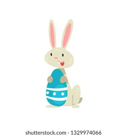 Cute White Easter Bunny with Blue Colored Egg, Adorable Rabbit Cartoon Character Vector Illustration