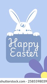 Cute white easter bunny holding a blue sign with the message happy easter written on it, with a purple flower in the foreground, perfect for easter greetings