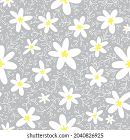 Cute white flowers with yellow hearts and small twigs and leaves. Seamless botanical pattern. Vector image.