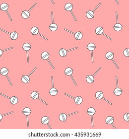 cute white lollipops on pink background seamless vector pattern illustration