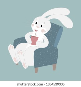 A cute white rabbit sits in a chair and drinks hot cocoa from a red mug.
Cartoon character on a New Year background. Vector illustration.