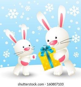 Cute white rabbits with gift