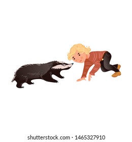 Cute wild forest badger is playing with blonde hair boy