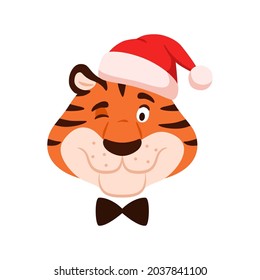 Cute winking tiger head isolated on white background. Cartoon striped color happy character portrait in Santa hat. Adorable Chinese New Year symbol. Christmas holiday flat wildcat vector illustration.