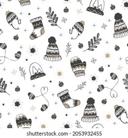 Cute winter, clothes pattern in white black and gold colors.