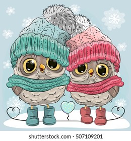 Cute winter illustration Two Owls Boy and Girl in hats and scarves