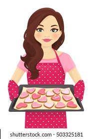 Cute woman holding baking tray with heart shape cookies decorated Valentines day isolated