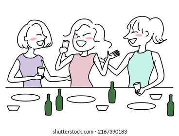 Cute women drinking beer together after work. Cheerful friends toasting glasses of alcohol. Businesswomen going out boozing together. Happy women drinking alcohol together. Three girls enjoying drink.