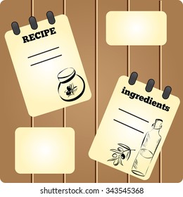 Cute wooden background with pages for recipes.