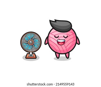 cute yarn ball is standing in front of the fan , cute design