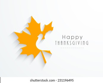 Cute yellow maples leave with turkey bird cutting on white background for Happy Thanksgiving Day celebrations. 