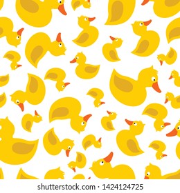 Cute yellow rubber duck with eye, orange beak, tale, wing, without paws, topknot, crest. Vector seamless pattern. Customized fun background. For cards, baby shower, paper, fabric, wallpaper. 