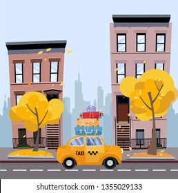 Cute yellow taxi with suitcases on the roof rides on a cozy city street with apartment buildings with the silhouette of skyscrapers in the distance. Autumn cityscape. Vector flat cartoon illustration