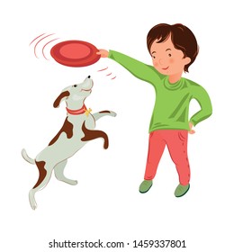 Cute young boy in green sweater play with domestic dog
