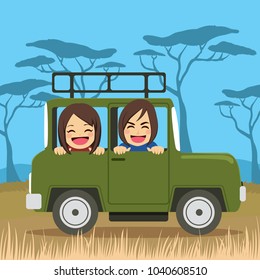 Cute young couple on safari tour vacation riding car happy
