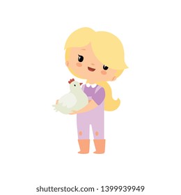 Cute Young Girl in Overalls and Rubber Boots Holding Chicken or Hen, Farmer Girl Cartoon Character Vector Illustration
